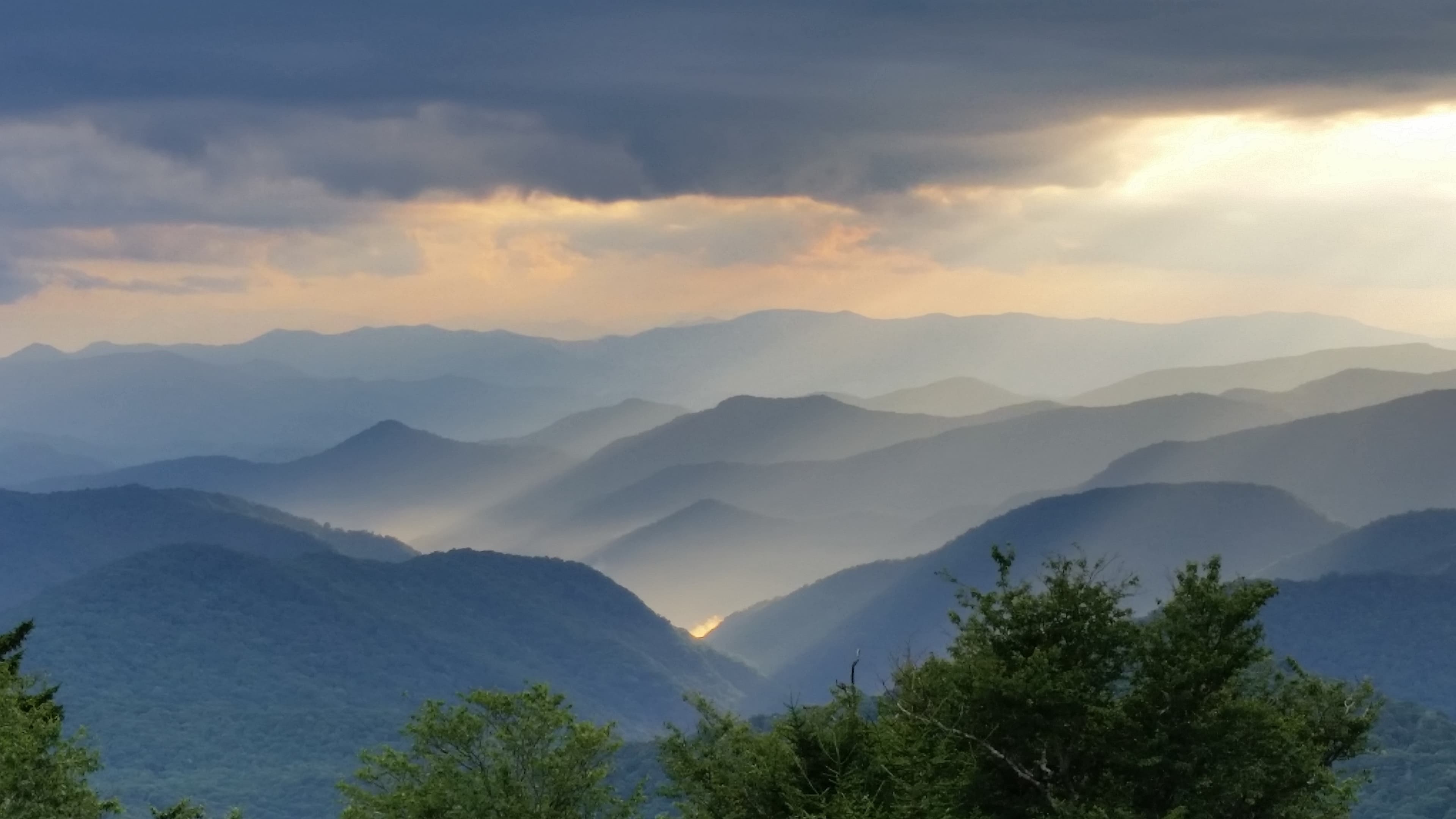 sun breaking through clouds over the Great Smoky Mountains National Park
